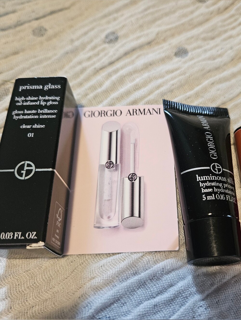 4 Giorgio Armani;  2 Lip in Venetian Red, gloss and primer.